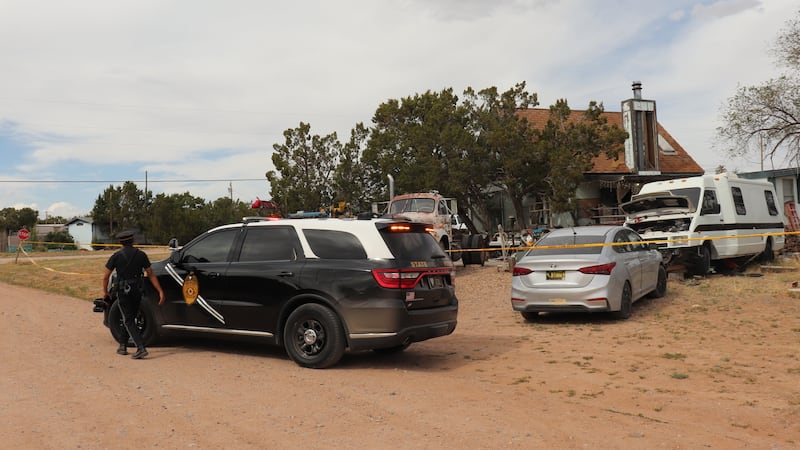 New Mexico State Police respond to home in Mountainair, N.M., where authorities say several...