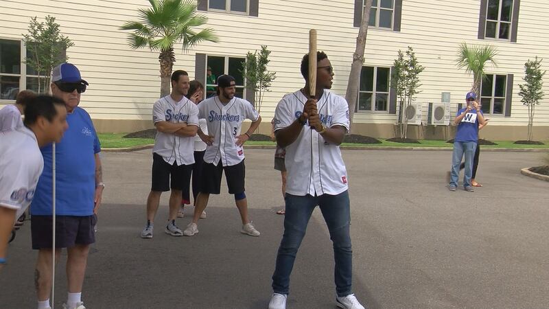 Biloxi Shuckers players get ready to bat against the Bay Cove Wannabes.