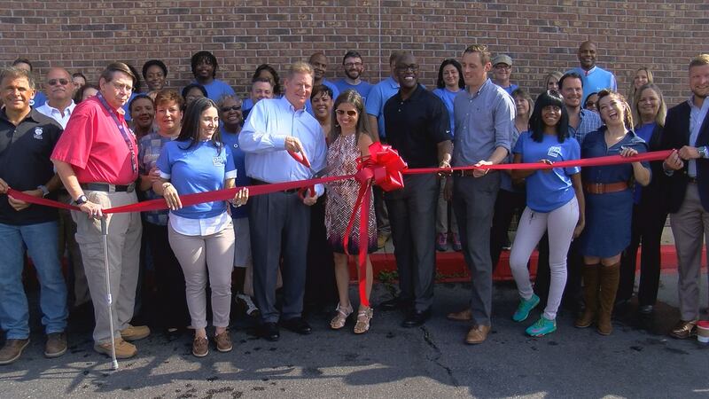 Local business leaders and Goodwill staff cut the ribbon at the new mega store in Ocean Springs.